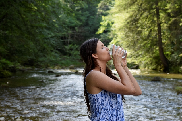 Woman drinking a glass of water, Clean Drinking Water for Good Health